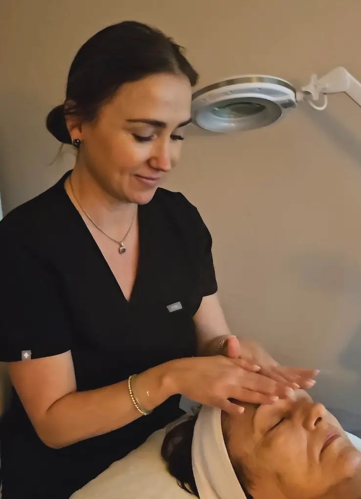 Licensed esthetician Megan Sheehan providing expert facial treatment in Brentwood, TN